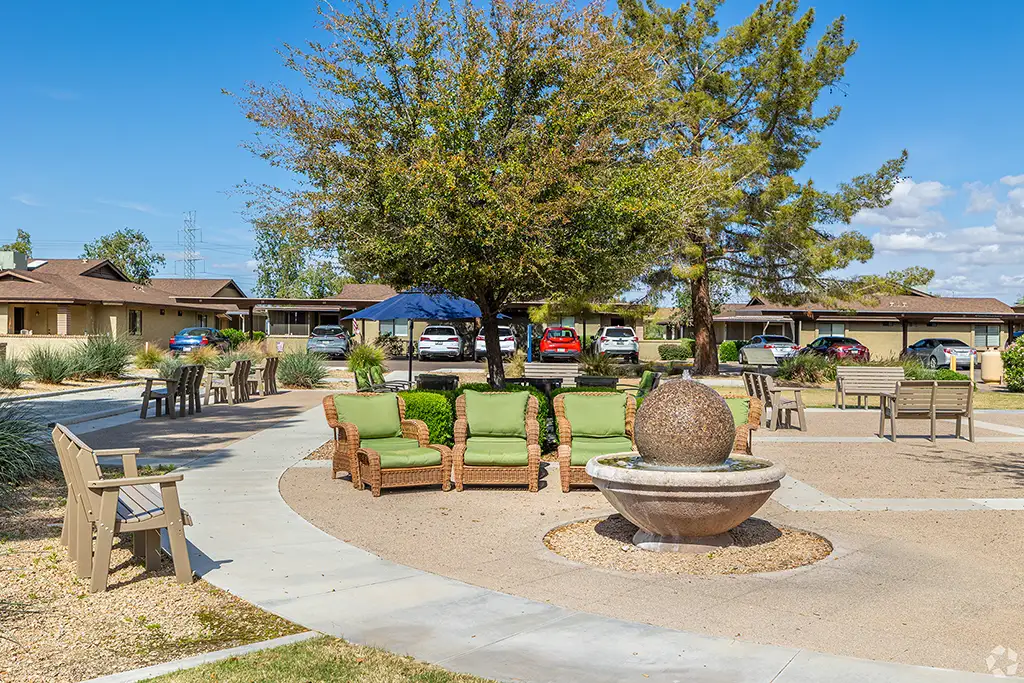Outdoor Walking Path with Fountain and Seating Area